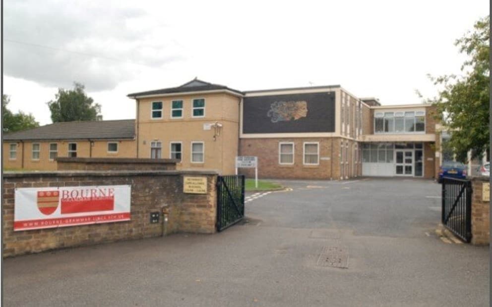 Front view of Bourne Grammar school. The building has a visible sign displayed.