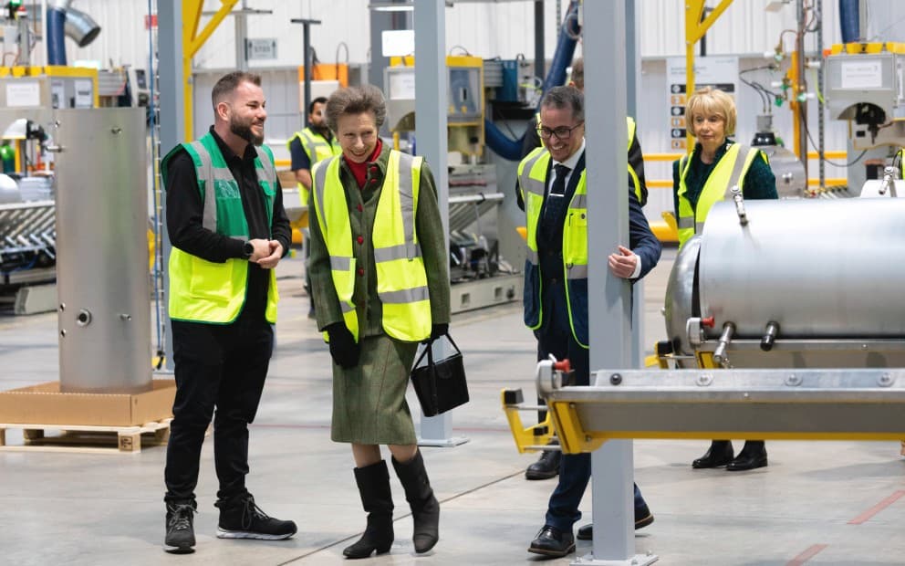 HRH Princess Anne looking at the inside shell of a cylinder in Vaillant's manufacturting plant.