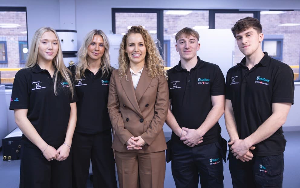Low Carbon Heating Technician Apprentices and Mechatronics Apprentices standing together.