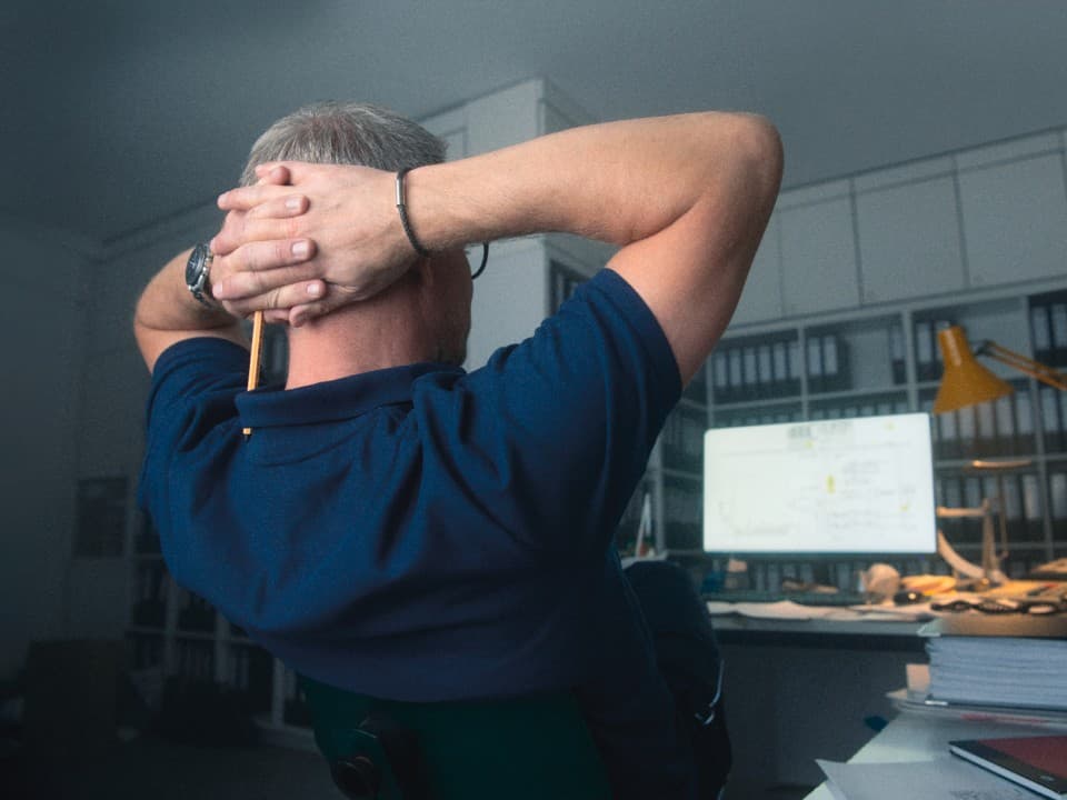 Installer sits in front of the desk